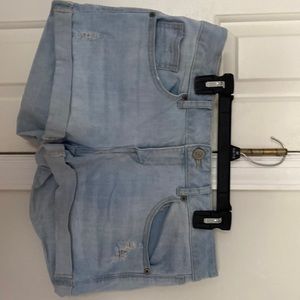 Light blue stretch denim cuffed ripped jeans